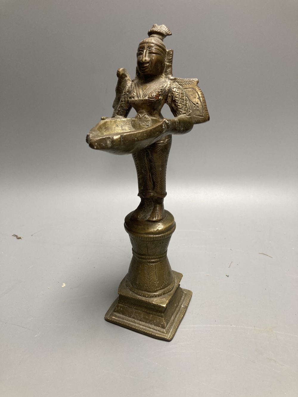 A Chinese bronze censor and a Buddhist figural stoop, stoop, 23cm high